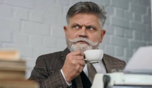 Uomo con i baffi beve un té (Depositphotos foto)